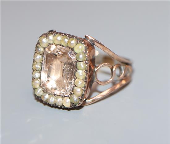 A Georgian yellow metal pink paste and seed pearl set ring, size I/J.